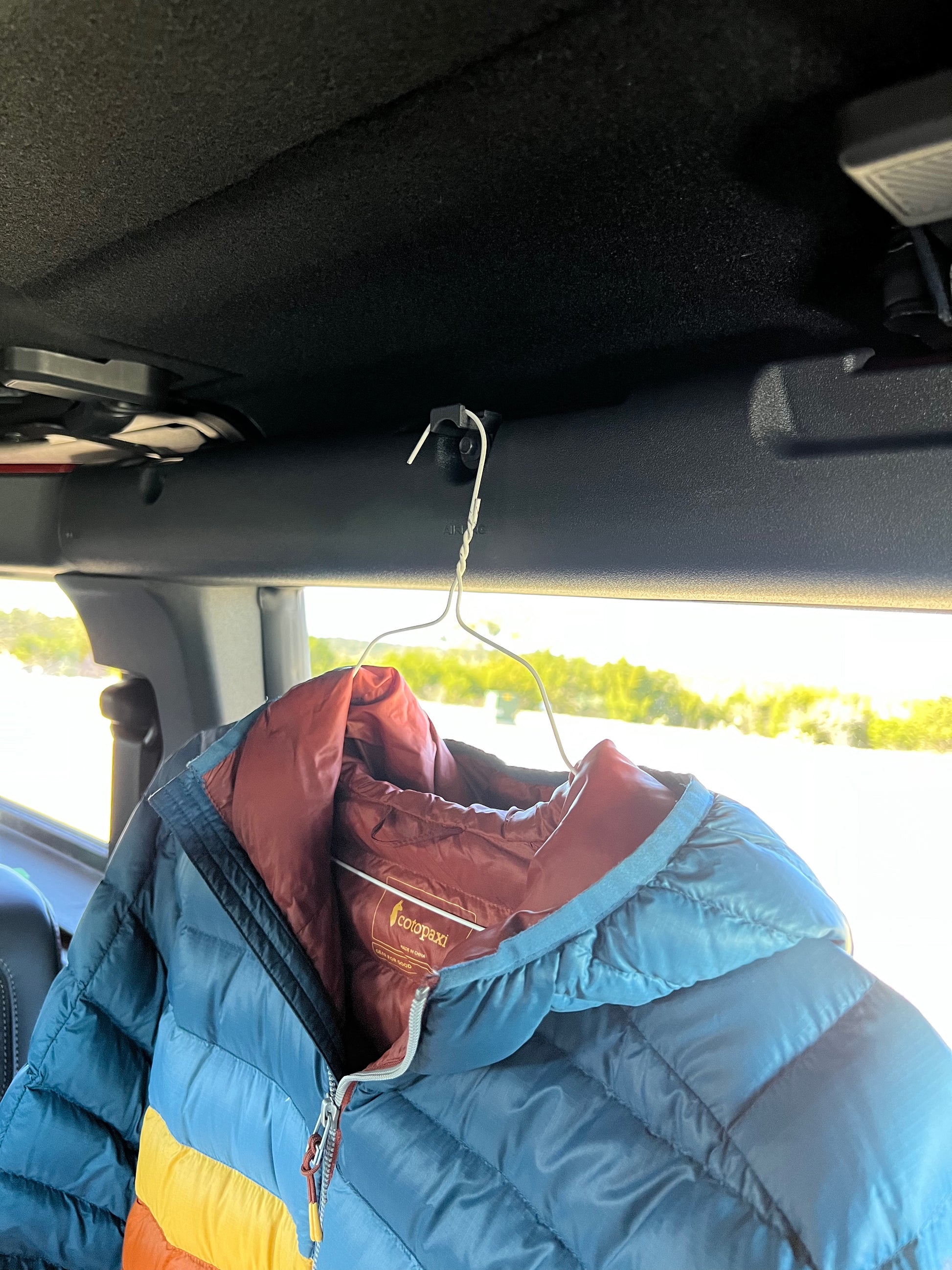 Jacket hanging from Ford Bronco garment hook