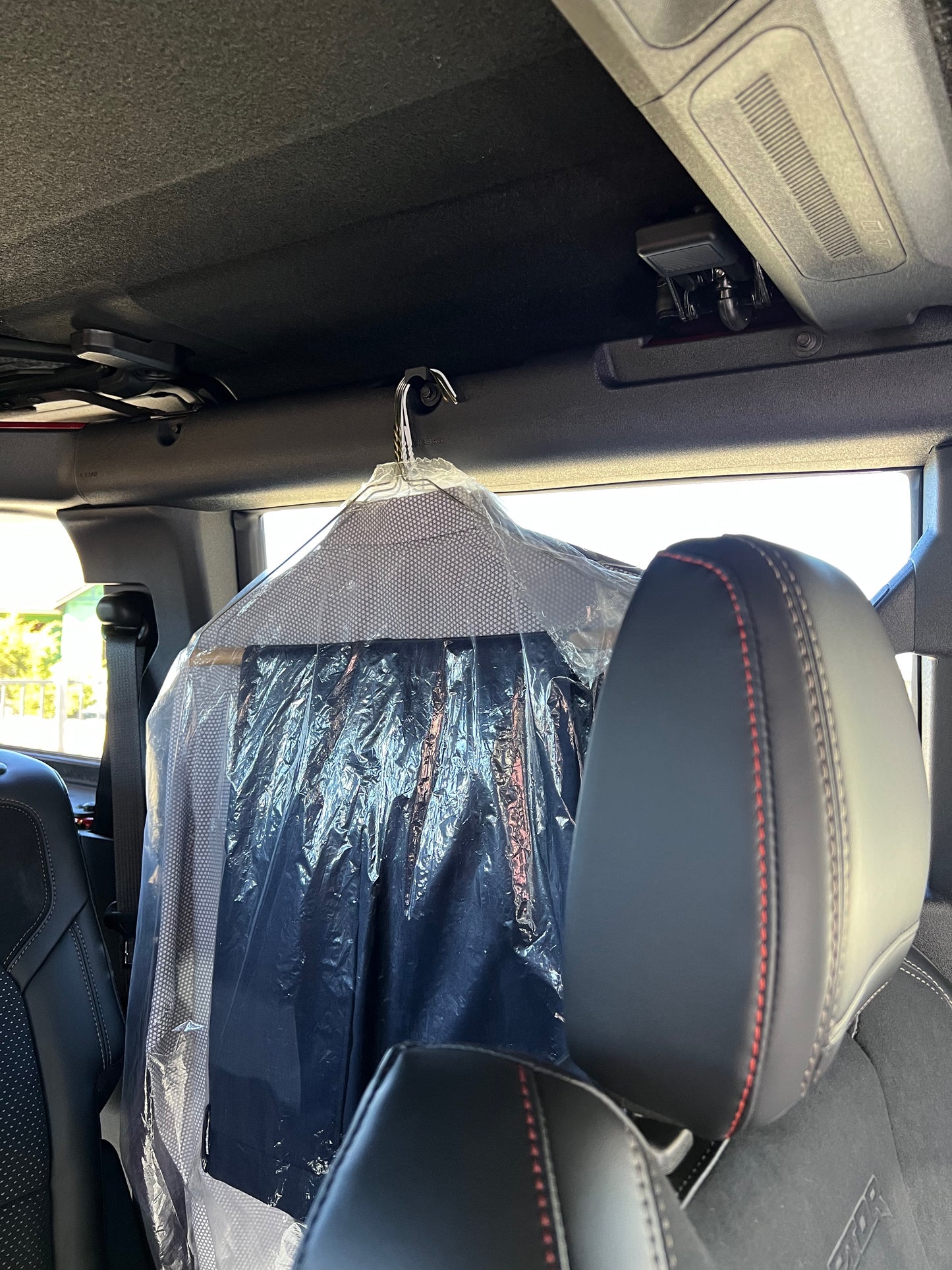 Garment hook holding dry cleaning in Ford Bronco