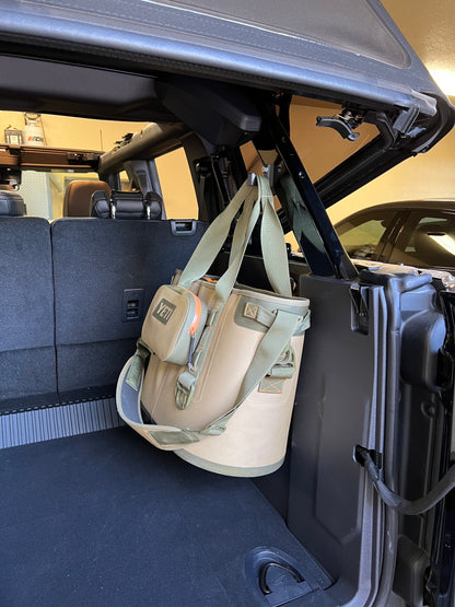 Yeti cooler hanging from Ford Bronco gear hook